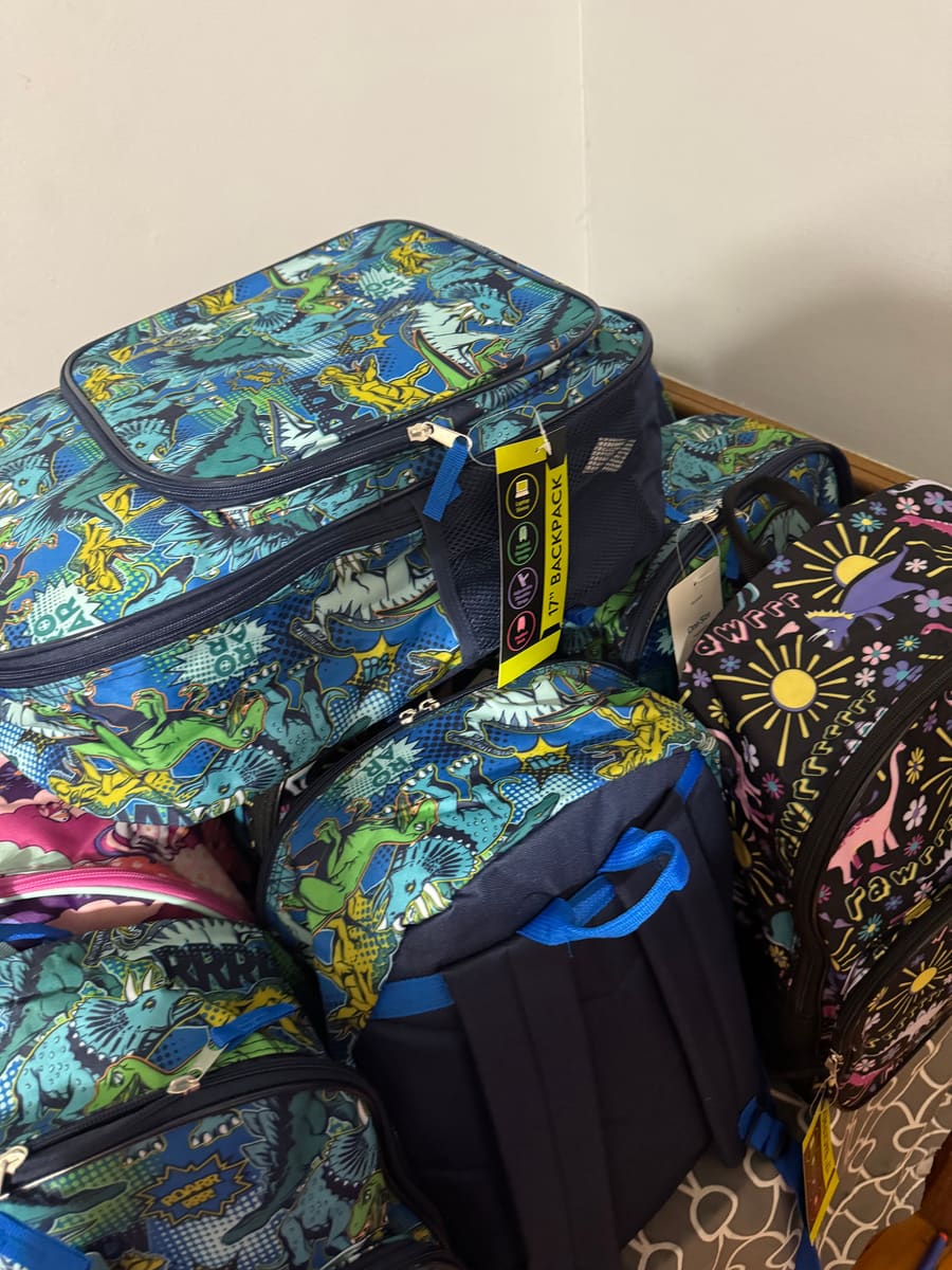 Backpacks stacked up before being handed out